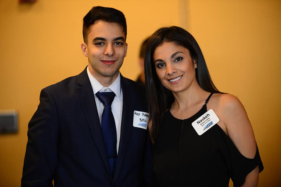 A guy and girl smiling for a picture