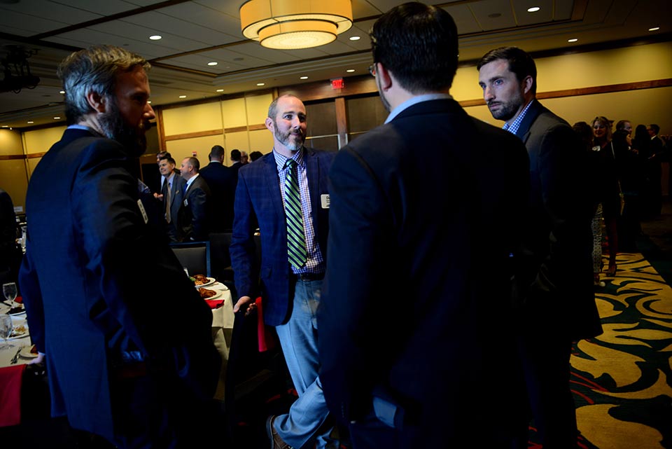 Men having conversation in an event