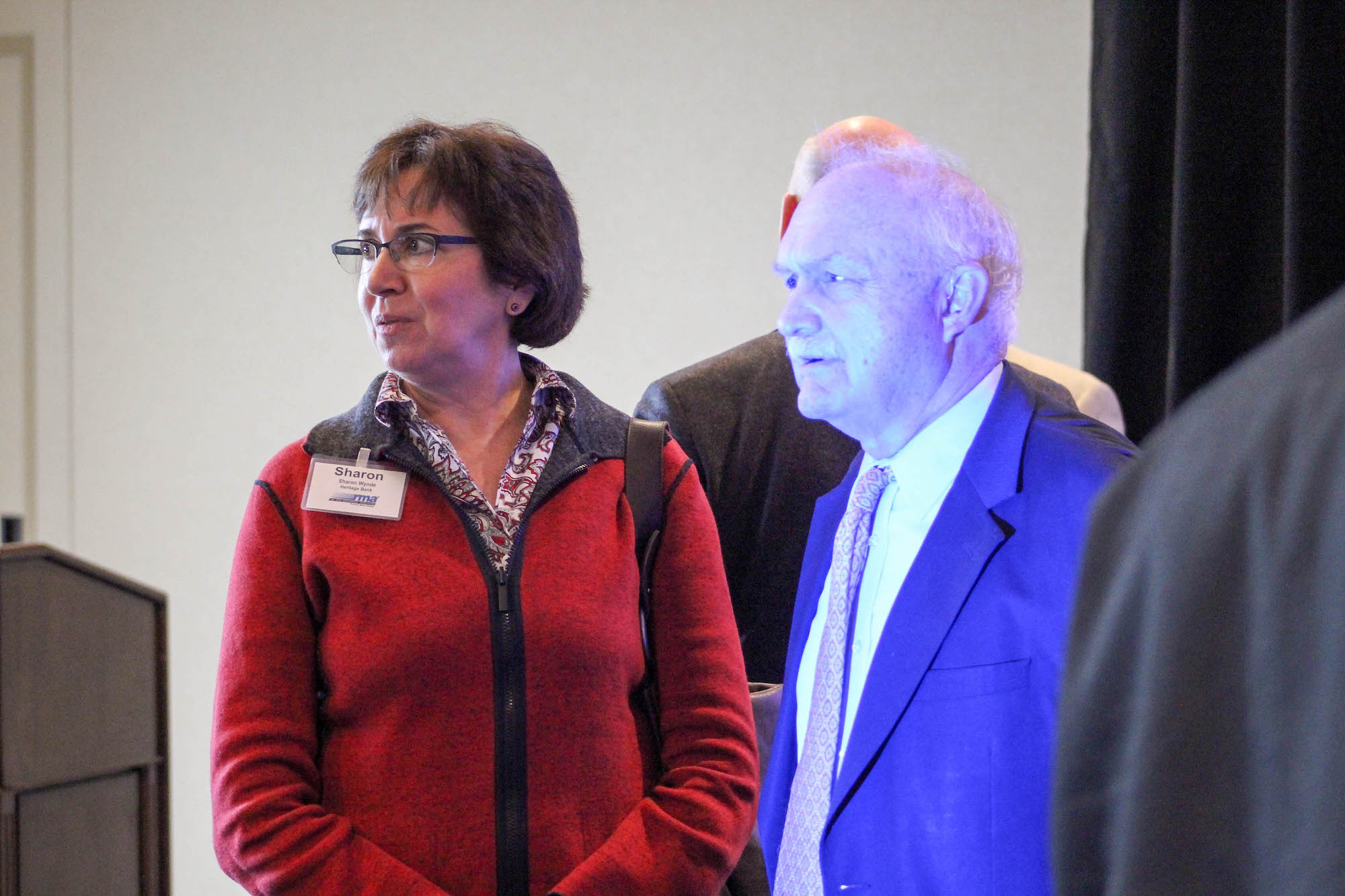 Man and woman standing in the room