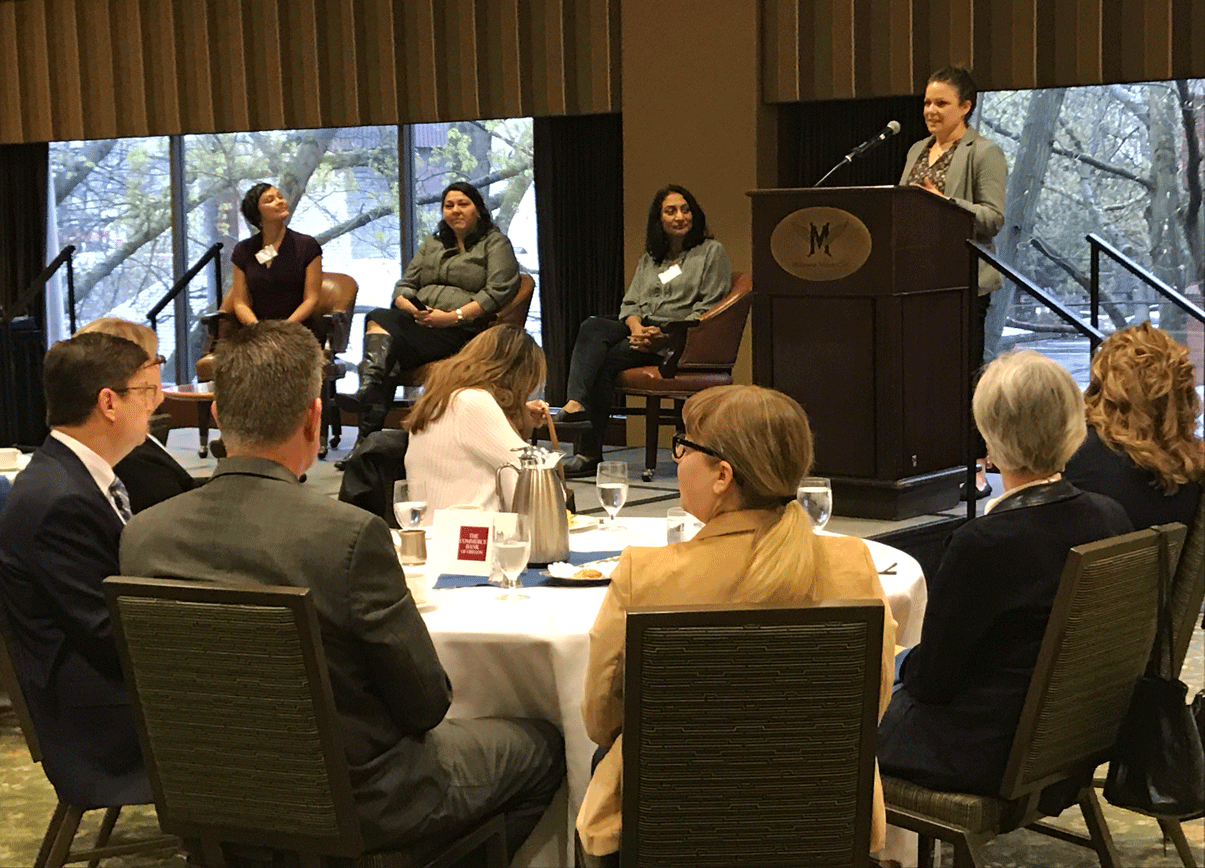 Woman addressing in a conference