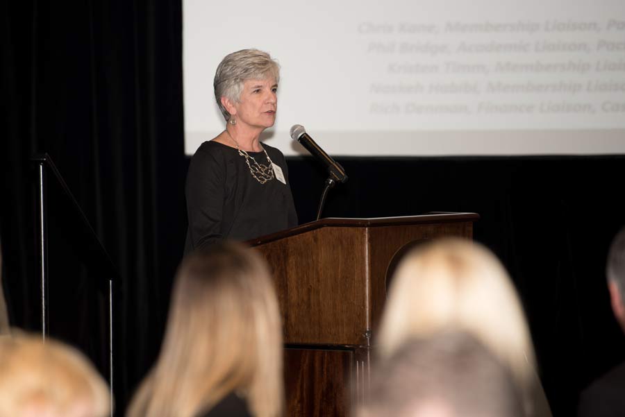 Old lady presenting on stage