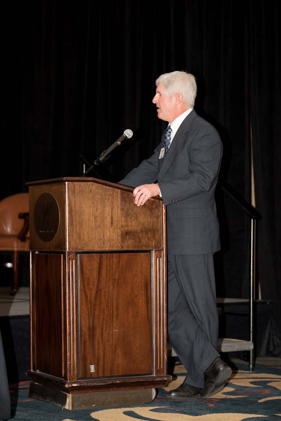 Man giving speech on stage