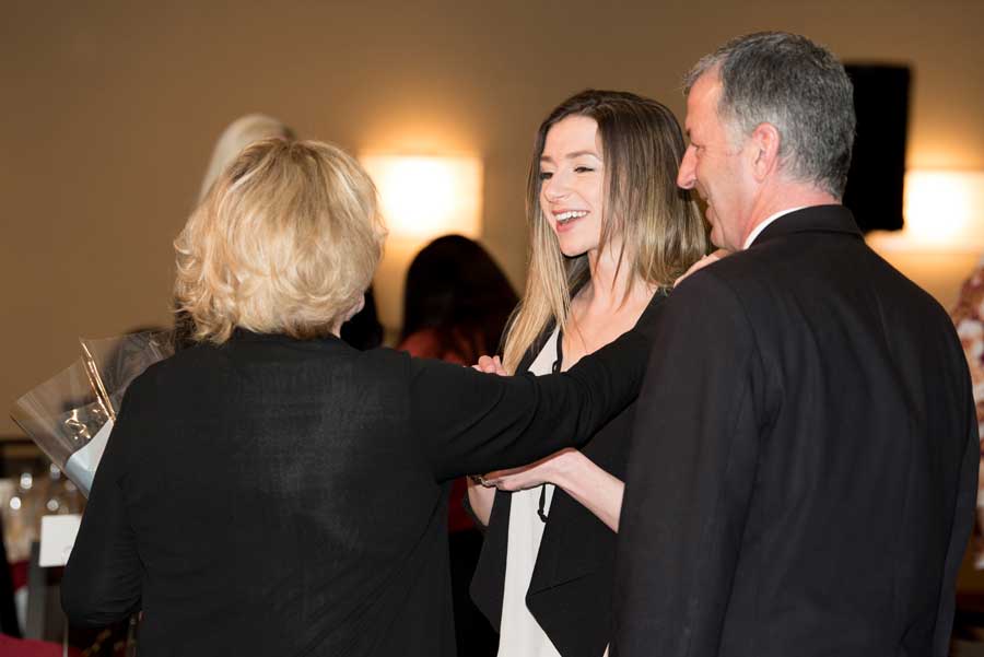 Girl smiling while meeting with a lady